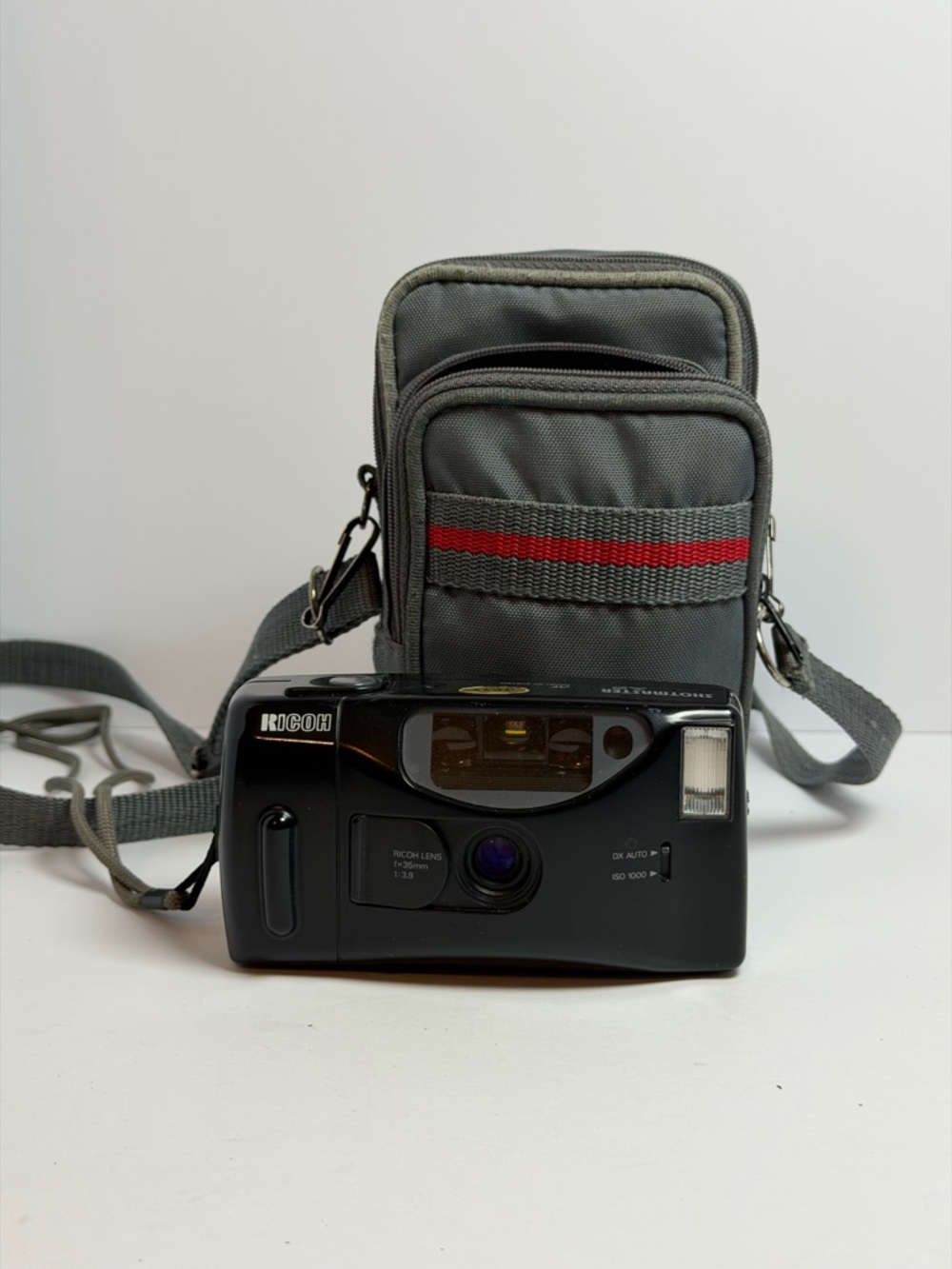 black Ricoh S-30 compact 35mm point-and-shoot film camera with a 35mm lens